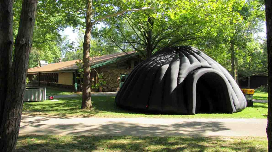inflatable tent in woods.