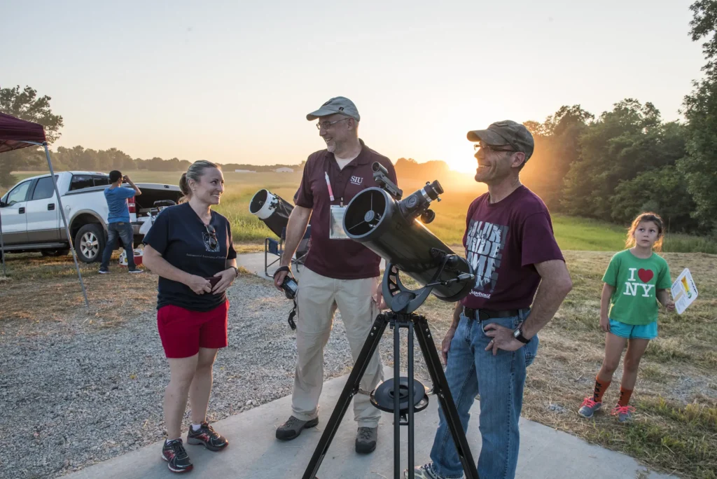 Group photo with telescope.